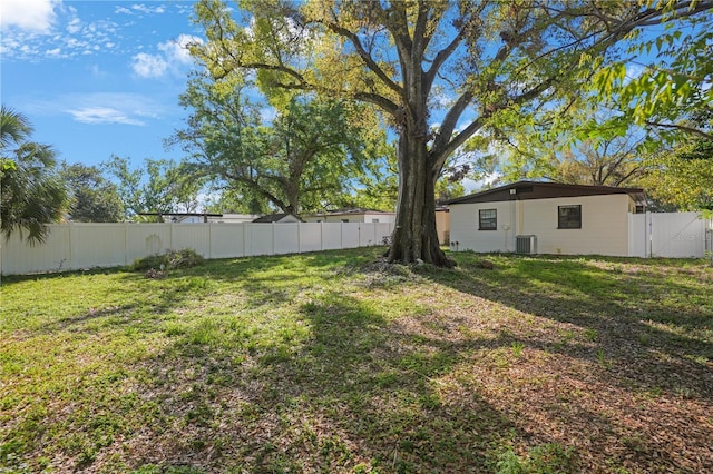 124 E 119th Ave, Tampa, FL 33612 - view of yard with cooling unit, a gate, and a fenced backyard