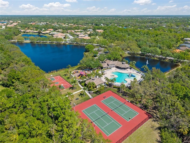 bird's eye view with a wooded view and a water view