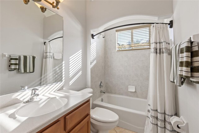 full bathroom featuring shower / bathtub combination with curtain, toilet, and vanity