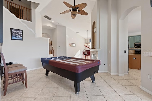 recreation room with visible vents, a ceiling fan, arched walkways, light tile patterned flooring, and pool table