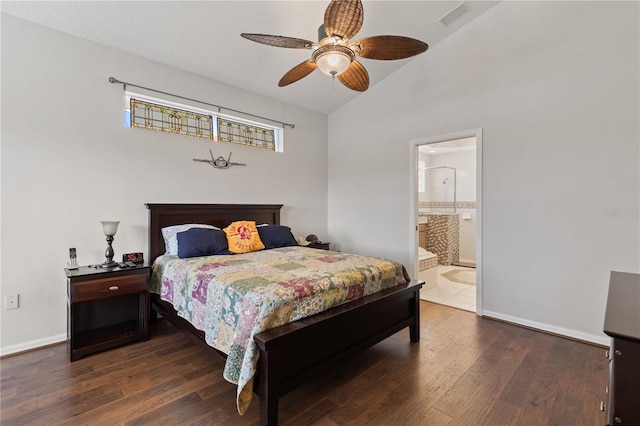 bedroom with vaulted ceiling, wood finished floors, baseboards, and visible vents