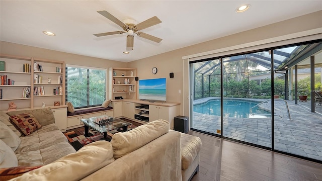 living area featuring hardwood / wood-style flooring, recessed lighting, and ceiling fan