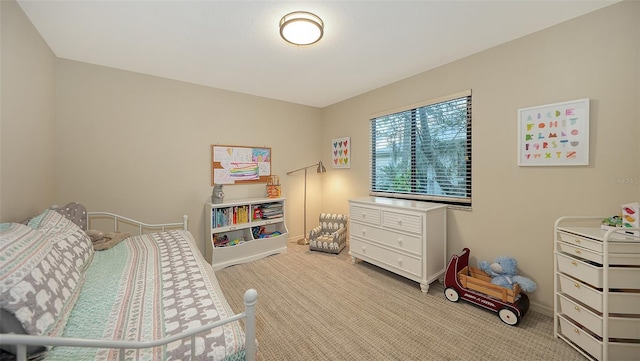 bedroom featuring light carpet