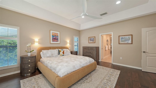 bedroom featuring visible vents, multiple windows, baseboards, and dark wood-style flooring