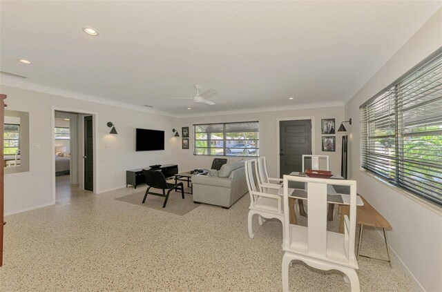 living room with a wealth of natural light, recessed lighting, and light speckled floor