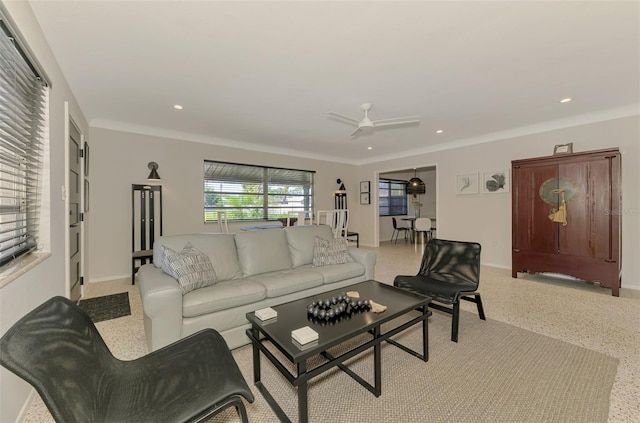 living area featuring recessed lighting, speckled floor, baseboards, and a ceiling fan