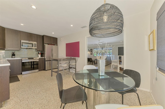 dining room with recessed lighting, visible vents, and baseboards