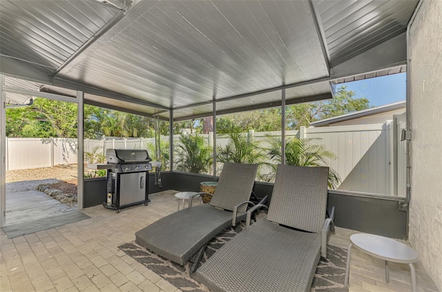 view of patio with a fenced backyard and a grill