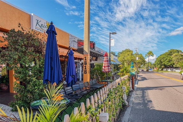 exterior space with street lighting and sidewalks