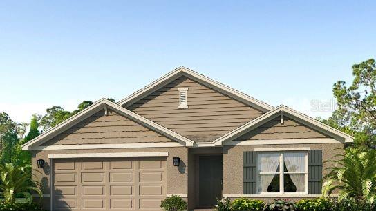 view of front of property featuring an attached garage and driveway