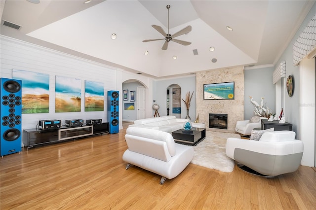 137 Big Pass Ln, Sarasota, FL 34242 - living area with a ceiling fan, wood finished floors, a large fireplace, lofted ceiling, and visible vents