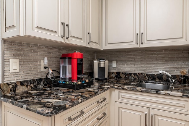 137 Big Pass Ln, Sarasota, FL 34242 - kitchen featuring white cabinetry, a sink, and decorative backsplash
