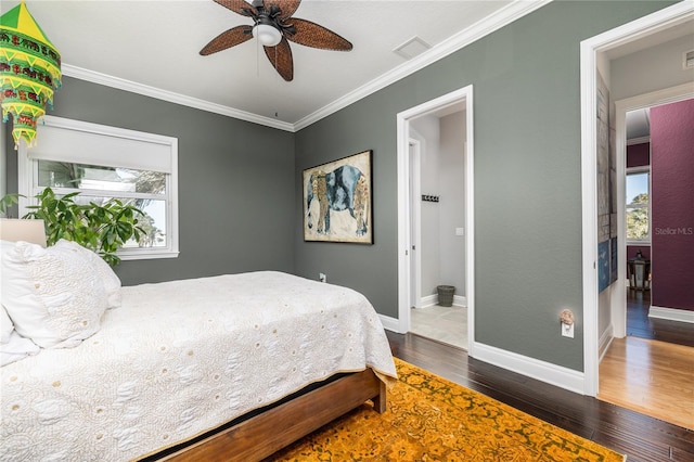 137 Big Pass Ln, Sarasota, FL 34242 - bedroom featuring baseboards, dark wood-style floors, ornamental molding, and visible vents