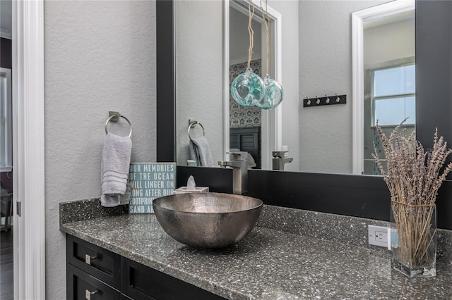 137 Big Pass Ln, Sarasota, FL 34242 - bathroom with a textured wall and vanity