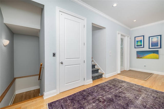 137 Big Pass Ln, Sarasota, FL 34242 - below grade area featuring baseboards, wood finished floors, and crown molding