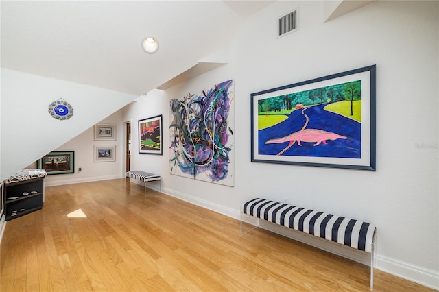 137 Big Pass Ln, Sarasota, FL 34242 - interior space with baseboards, vaulted ceiling, visible vents, and wood finished floors