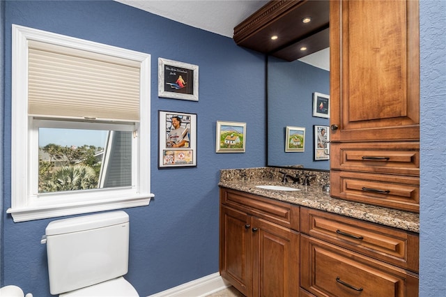137 Big Pass Ln, Sarasota, FL 34242 - bathroom with baseboards, toilet, and vanity