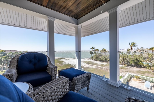 137 Big Pass Ln, Sarasota, FL 34242 - wooden terrace featuring an outdoor living space and a water view