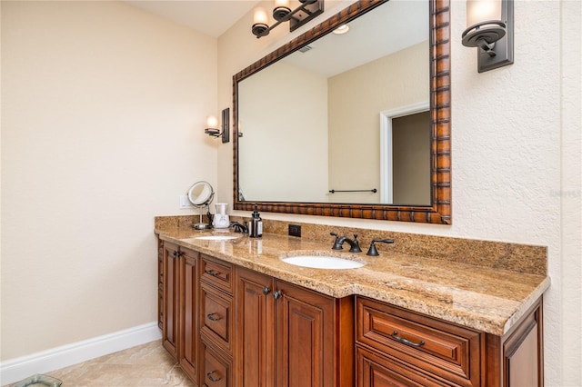 137 Big Pass Ln, Sarasota, FL 34242 - full bathroom with baseboards, double vanity, and a sink