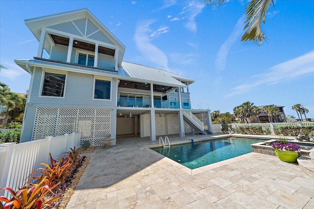 137 Big Pass Ln, Sarasota, FL 34242 - back of house featuring stairway, a fenced backyard, a sunroom, a patio, and ceiling fan