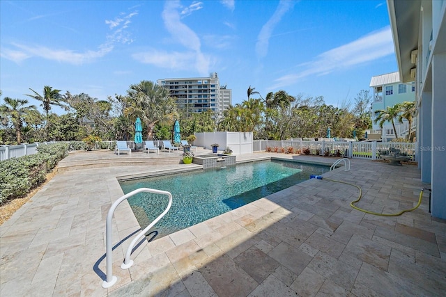 137 Big Pass Ln, Sarasota, FL 34242 - view of swimming pool featuring a patio, a fenced backyard, and a pool with connected hot tub