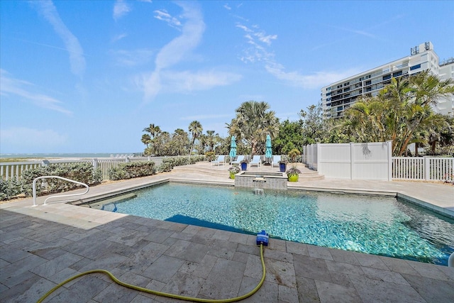 137 Big Pass Ln, Sarasota, FL 34242 - view of swimming pool with fence, a pool with connected hot tub, and a patio