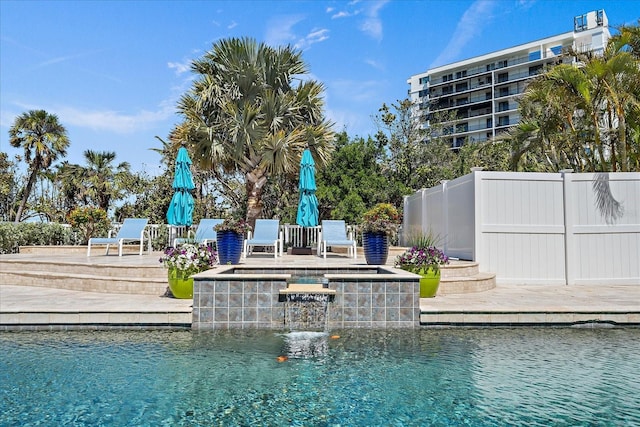 137 Big Pass Ln, Sarasota, FL 34242 - view of swimming pool featuring a pool with connected hot tub, fence, and a patio