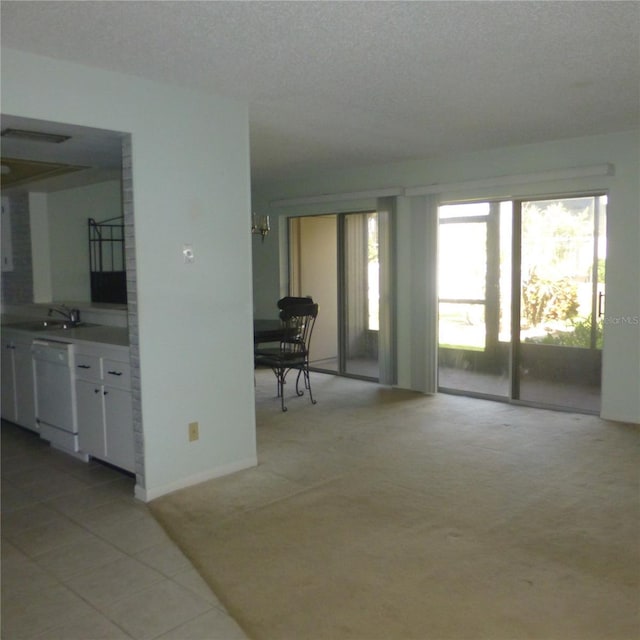 living room with light tile patterned flooring and a textured ceiling