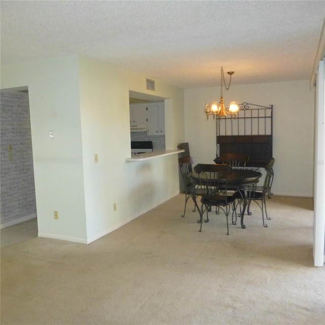 carpeted dining area featuring baseboards, visible vents, a chandelier, and a textured ceiling