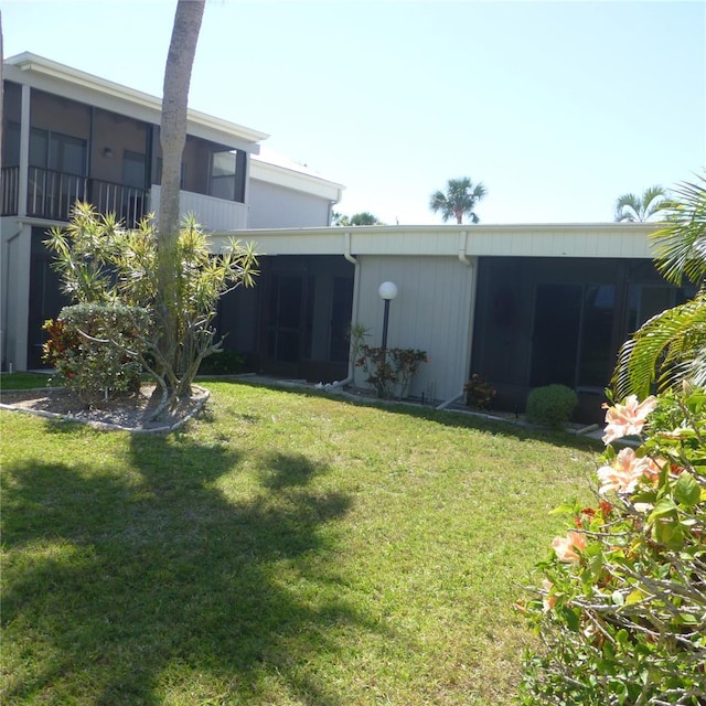 view of yard featuring a sunroom