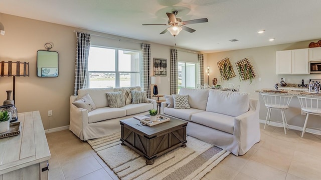 living room featuring light tile patterned floors, baseboards, visible vents, recessed lighting, and ceiling fan