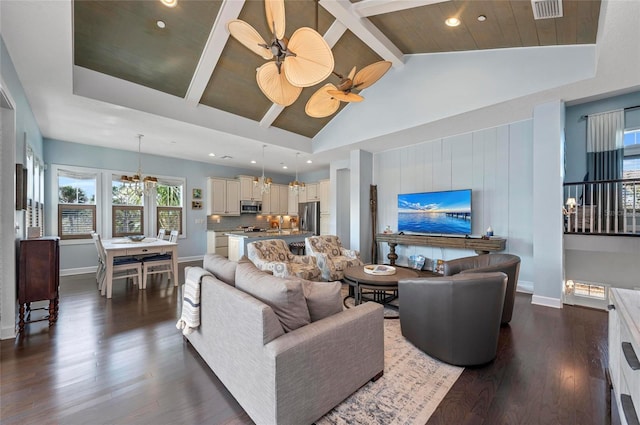 living room featuring dark wood-style floors, visible vents, high vaulted ceiling, beam ceiling, and ceiling fan with notable chandelier