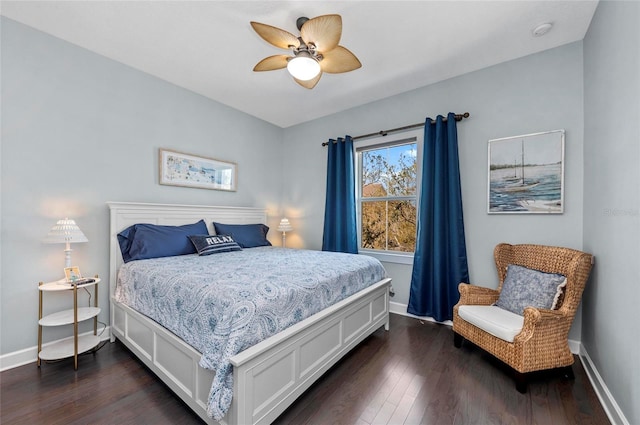 bedroom with baseboards, dark wood-style floors, and a ceiling fan