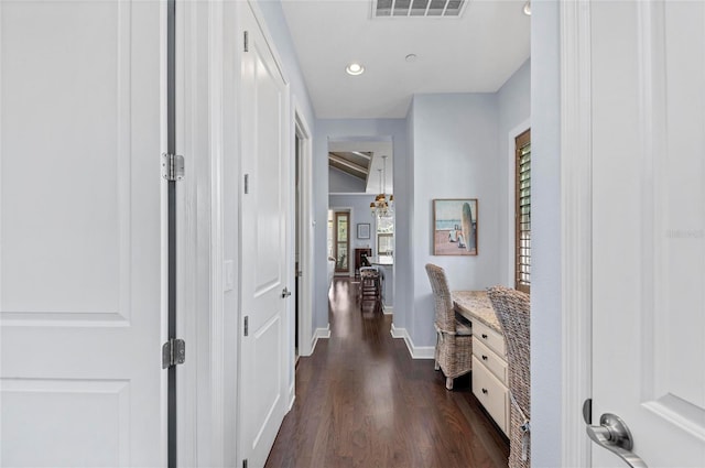 corridor with recessed lighting, visible vents, baseboards, and dark wood-style floors