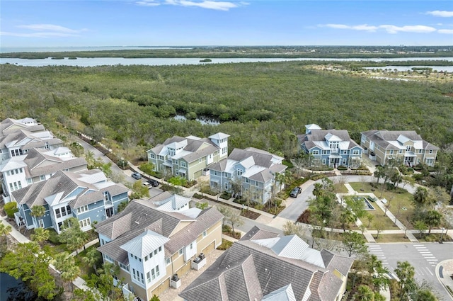 bird's eye view with a residential view and a water view