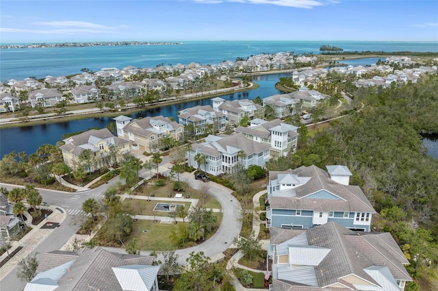 bird's eye view with a residential view and a water view