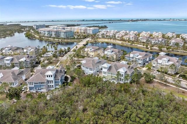 birds eye view of property with a residential view and a water view