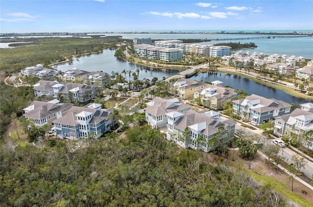 drone / aerial view with a water view and a residential view