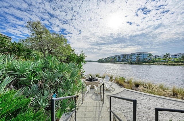 view of water feature with a fire pit