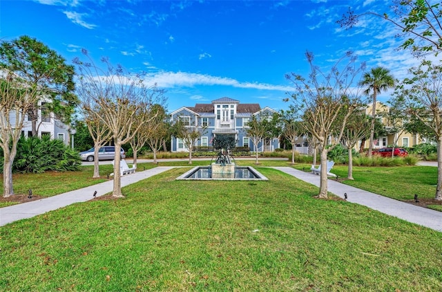 surrounding community featuring a lawn