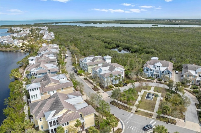 birds eye view of property featuring a residential view and a water view