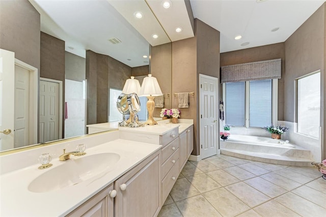 full bathroom featuring visible vents, tile patterned floors, recessed lighting, a bath, and vanity