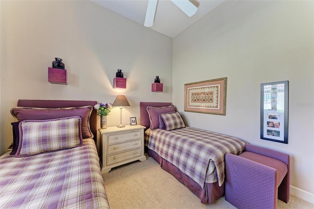 bedroom featuring lofted ceiling, light colored carpet, and ceiling fan