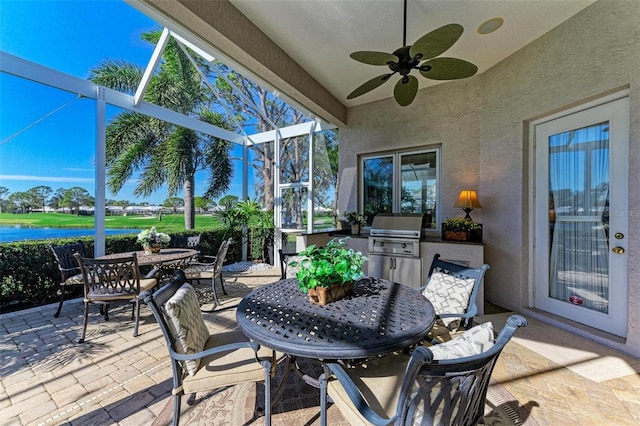 view of patio / terrace with a water view, grilling area, glass enclosure, outdoor dining area, and ceiling fan