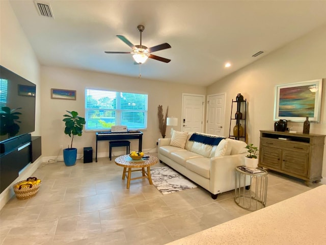 living room featuring baseboards, visible vents, a ceiling fan, and lofted ceiling