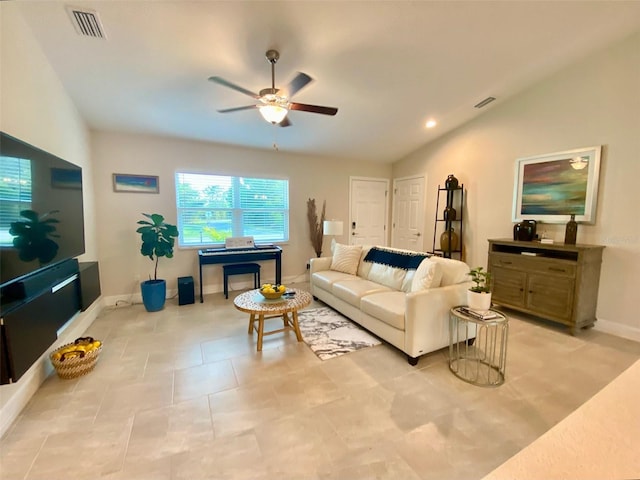 living area with visible vents, baseboards, a ceiling fan, and vaulted ceiling