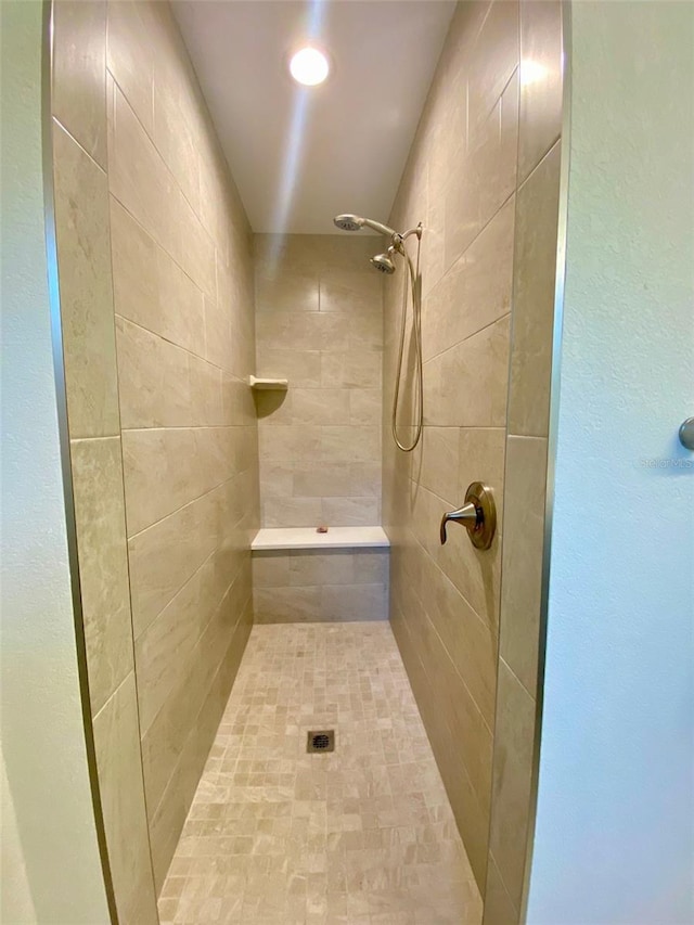 full bathroom with tiled shower