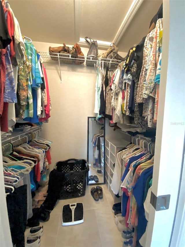 walk in closet featuring tile patterned flooring