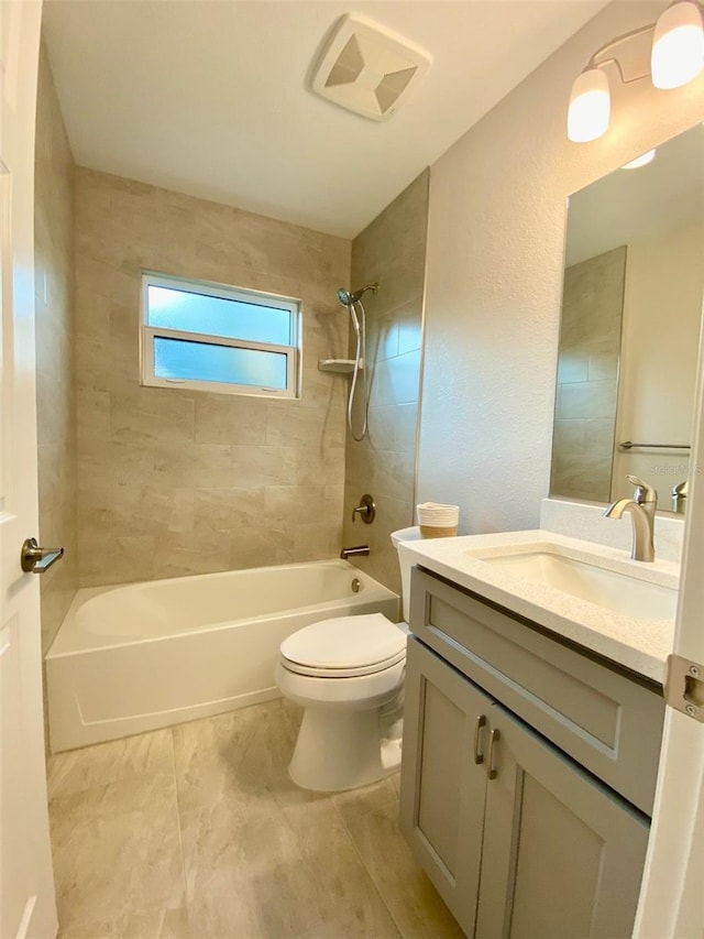 bathroom featuring vanity, toilet, washtub / shower combination, and visible vents