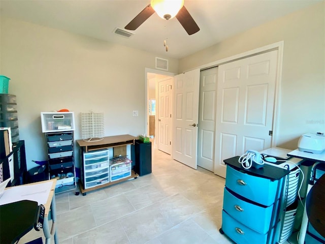 home office featuring visible vents and a ceiling fan